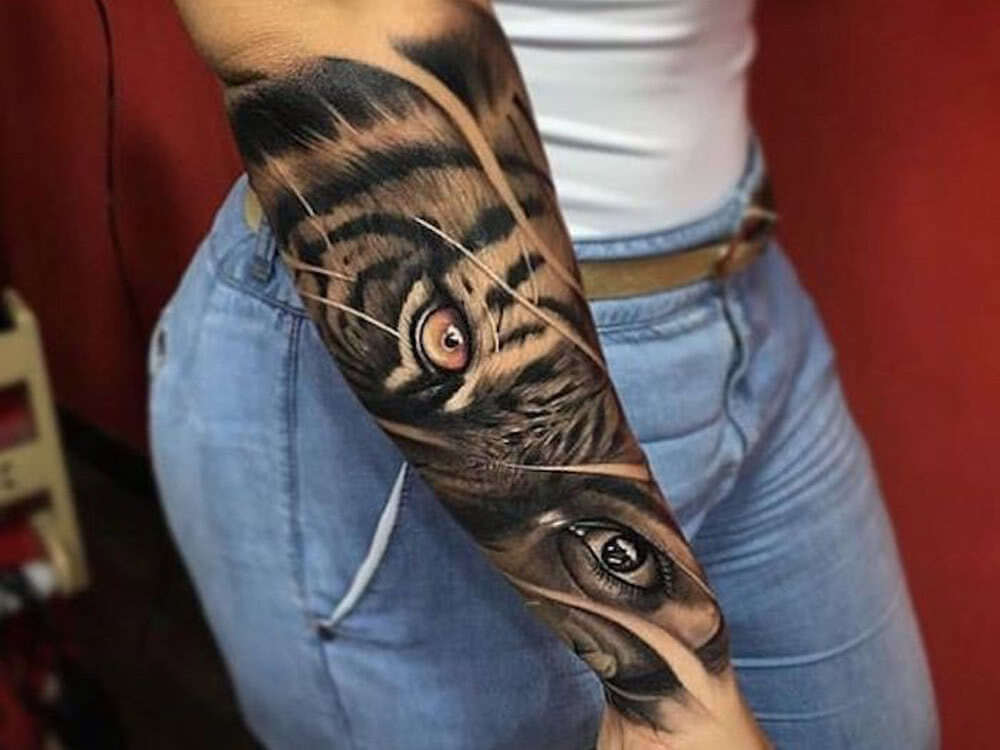 arm tattoo feline eye