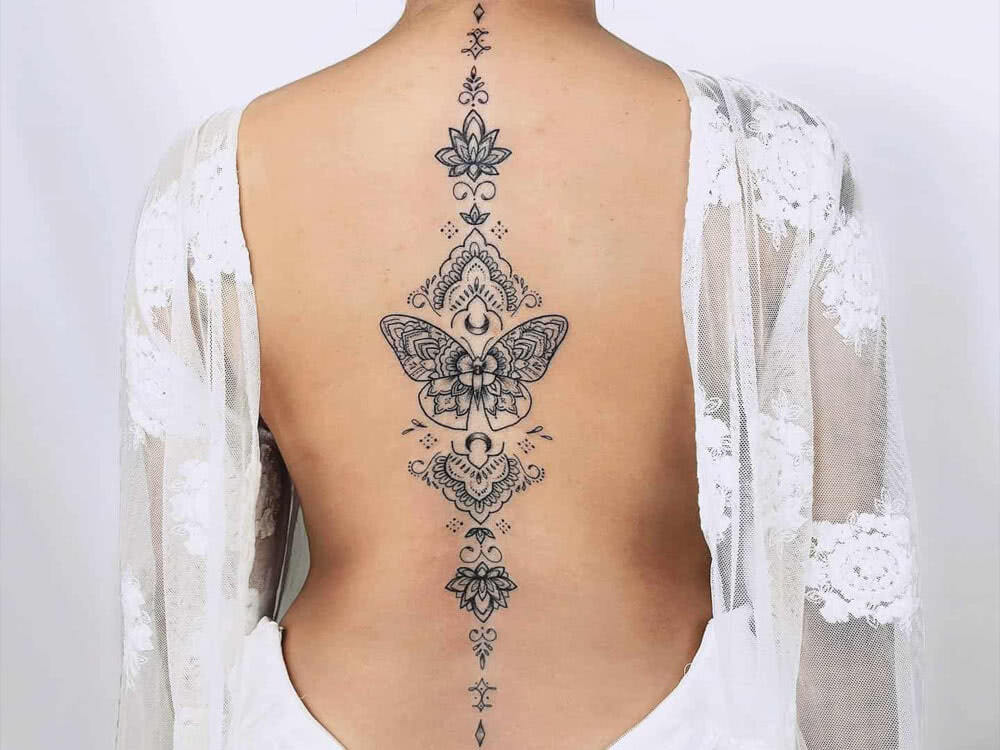 women tattoo back butterfly