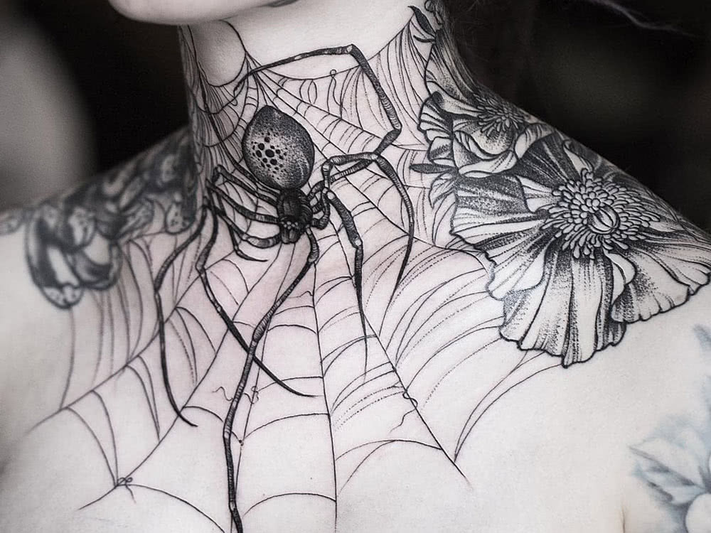 beautiful tattoo on the throat of a spider